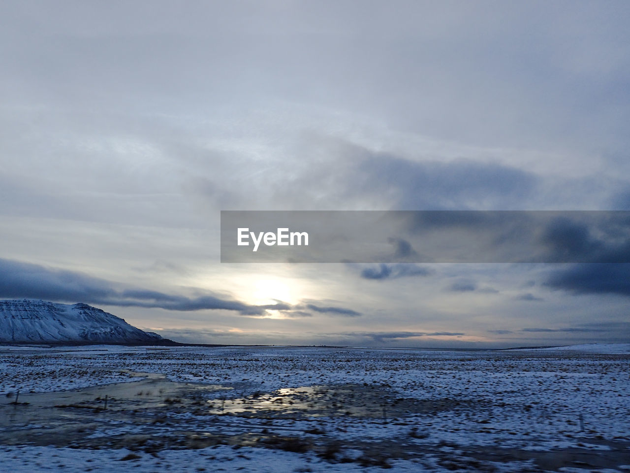 Scenic view of sea against sky during winter