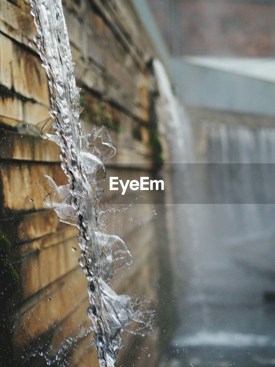 CLOSE-UP OF WATER DROPS ON WHITE SURFACE