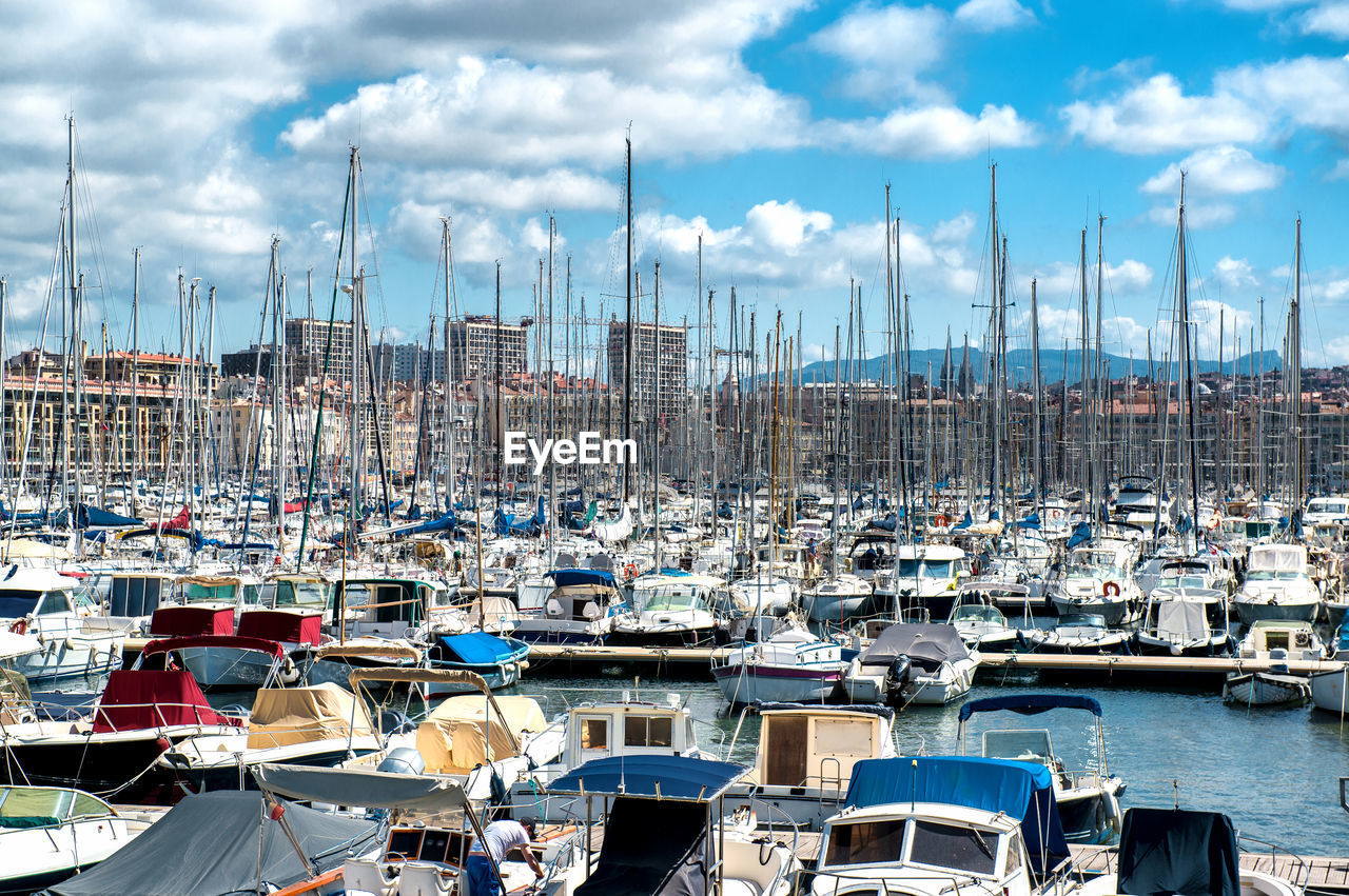 Boats moored at harbor