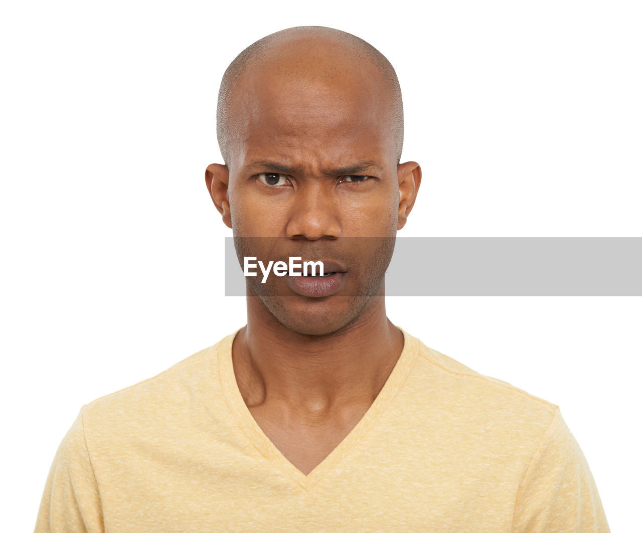 portrait, shaved head, one person, studio shot, white background, headshot, adult, men, looking at camera, indoors, casual clothing, cut out, front view, person, emotion, completely bald, human face, serious, young adult, copy space, human hair, human head, relaxation, chin, finger, facial expression, looking, negative emotion, clothing, balding, t-shirt