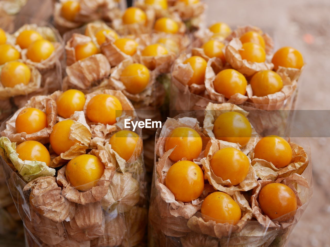 Juicy ripe cape gooseberry fruit, physalis peruviana, goldenberry, poha, in bag ready to be shopped 