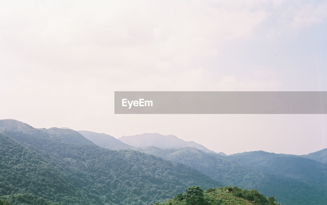 SCENIC VIEW OF MOUNTAIN RANGE AGAINST SKY
