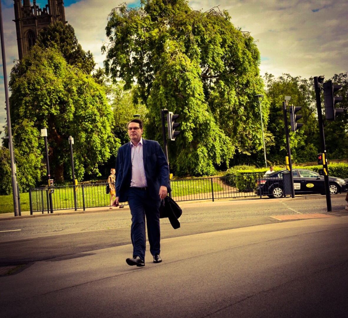 FULL LENGTH OF MAN WALKING ON STREET