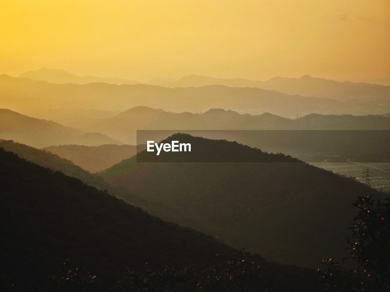 SCENIC VIEW OF MOUNTAIN RANGE AGAINST SKY DURING SUNSET