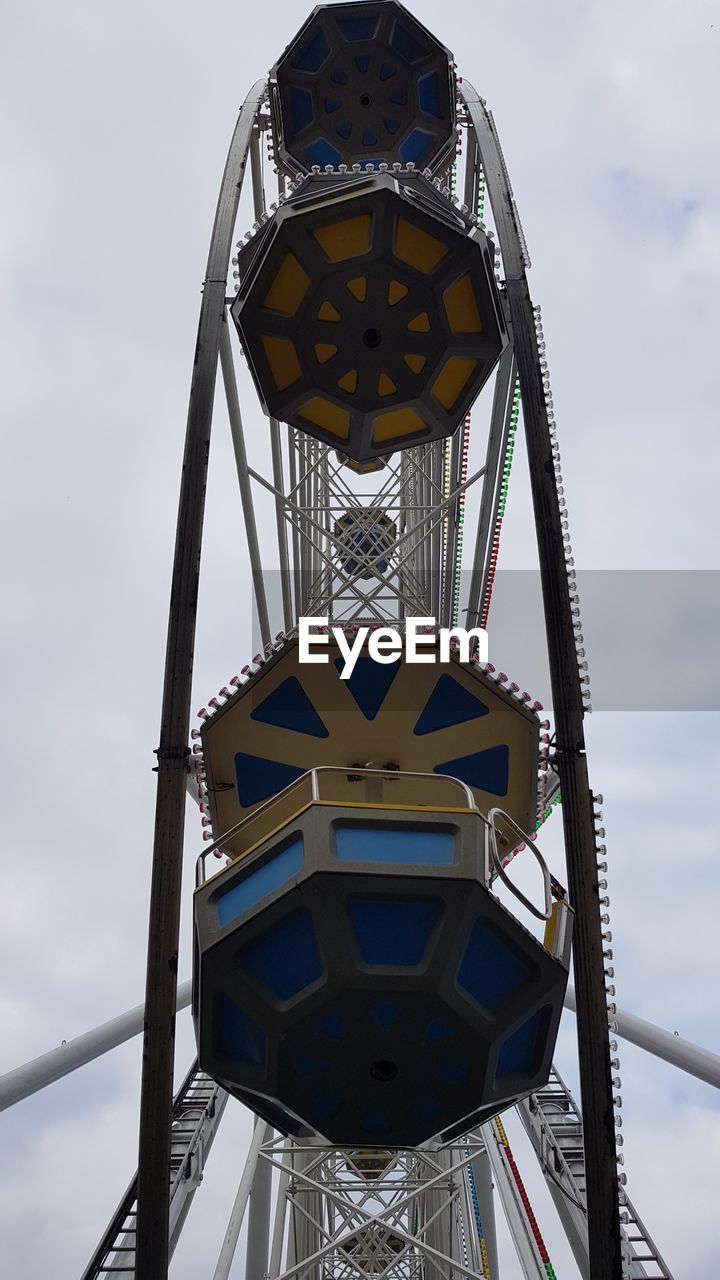 LOW ANGLE VIEW OF ROLLERCOASTER AGAINST SKY