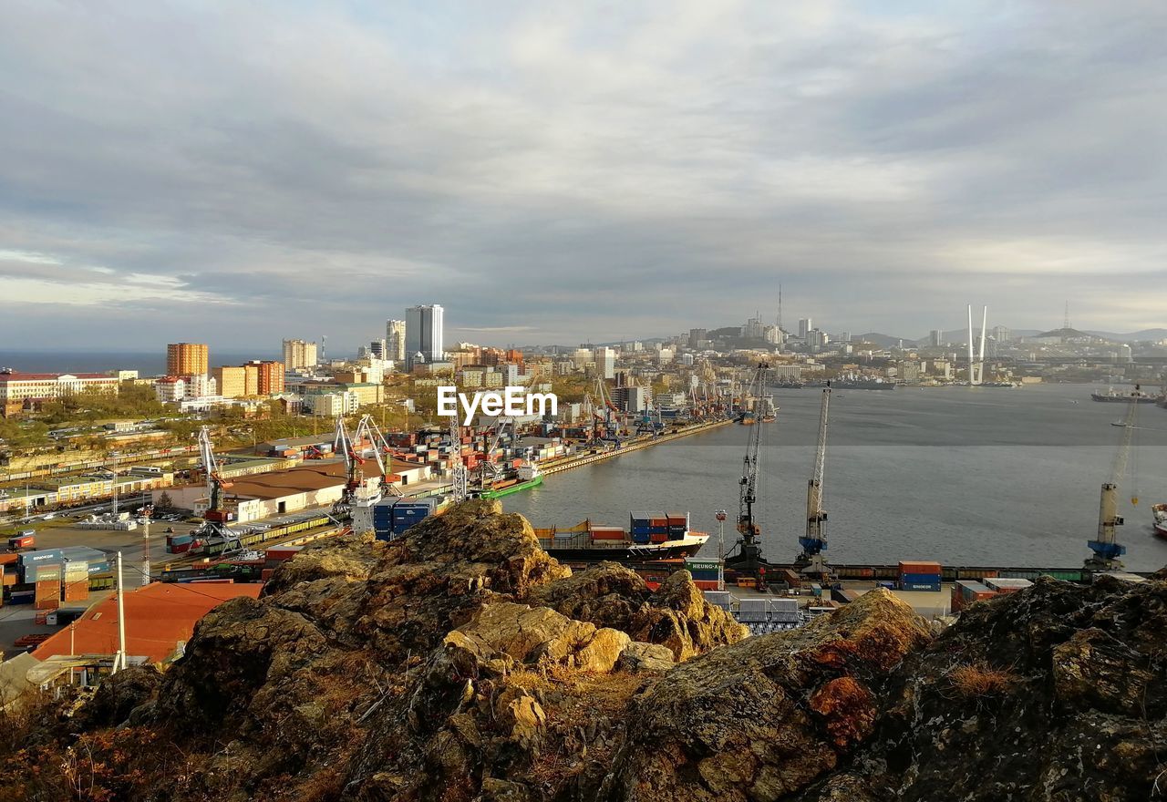 Panoramic view of sea and buildings against sky