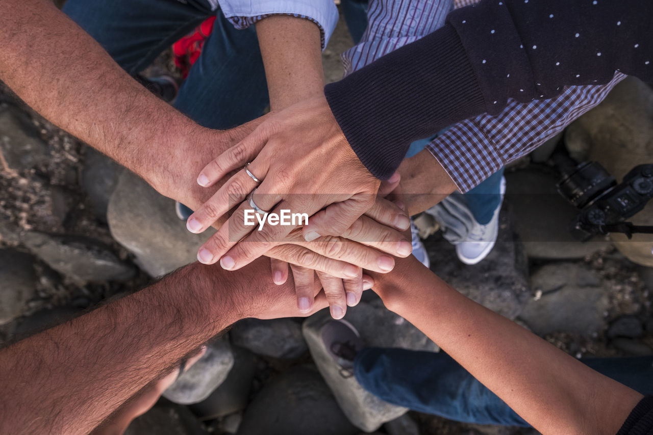 Close-up of friends stacking hands