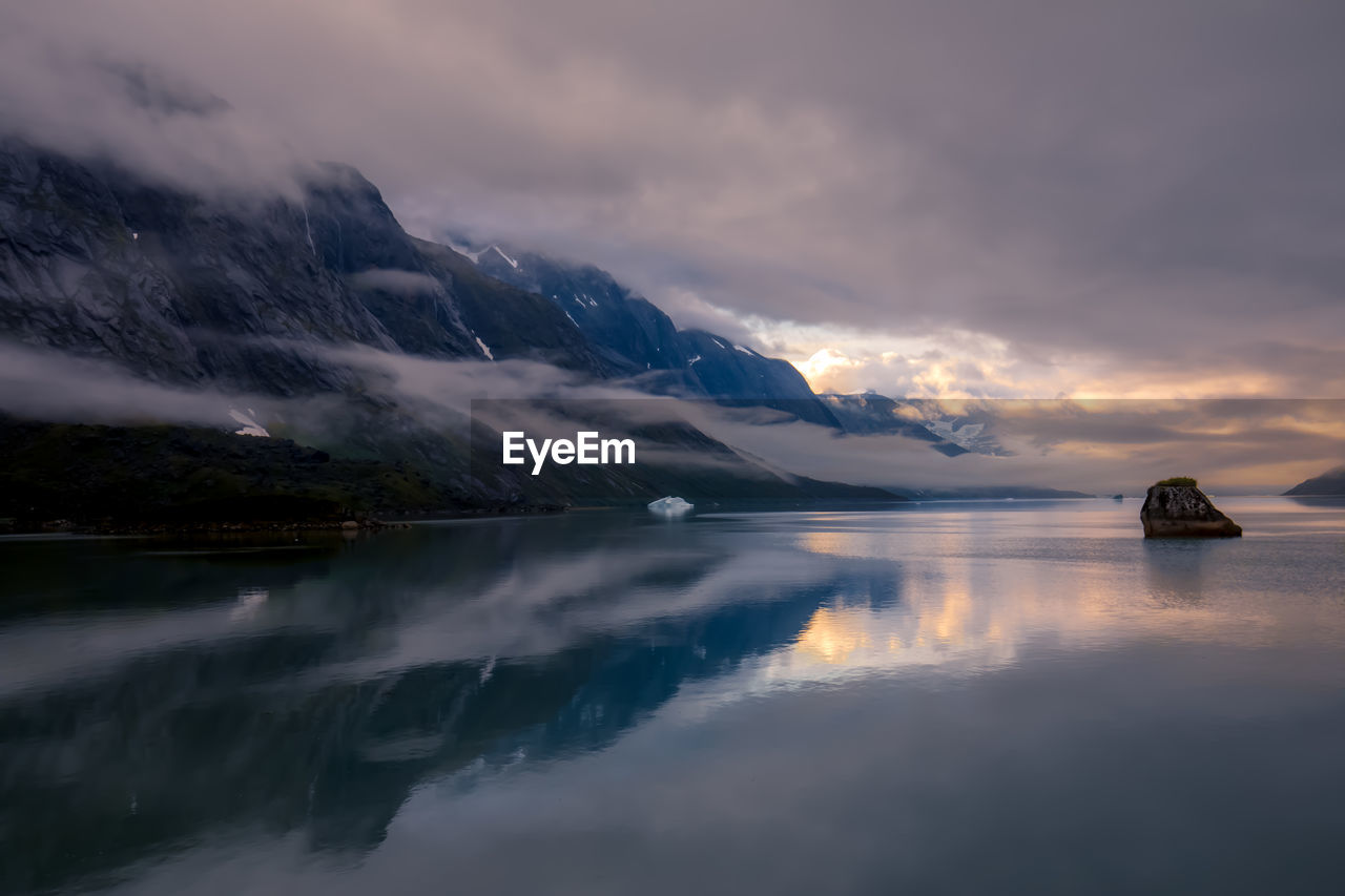 Scenic view of lake against sky during sunset