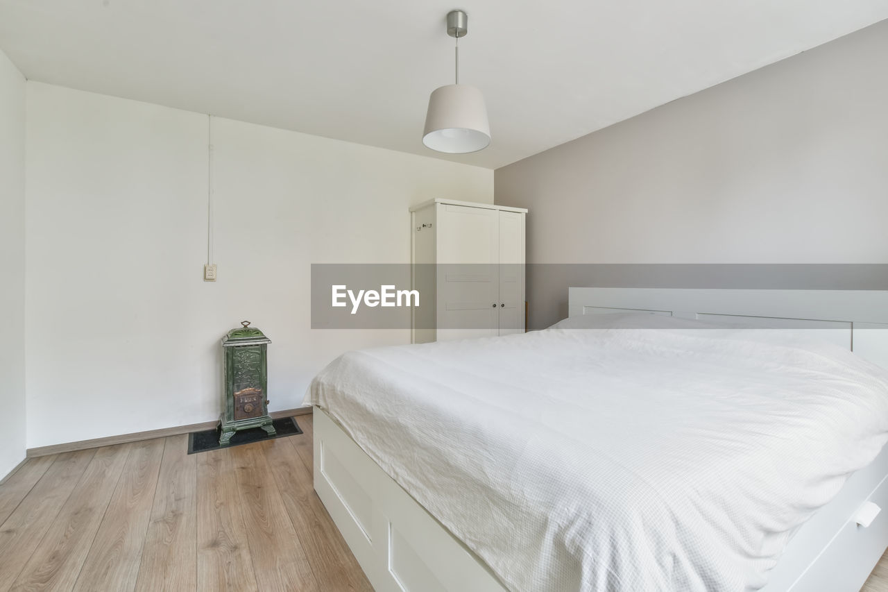 View of cozy bed in bedroom