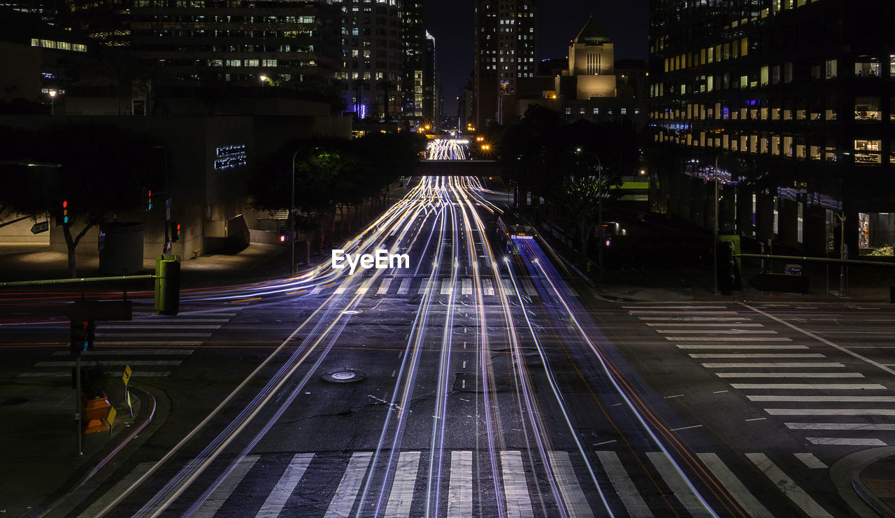 High angle view of street at night with light trails