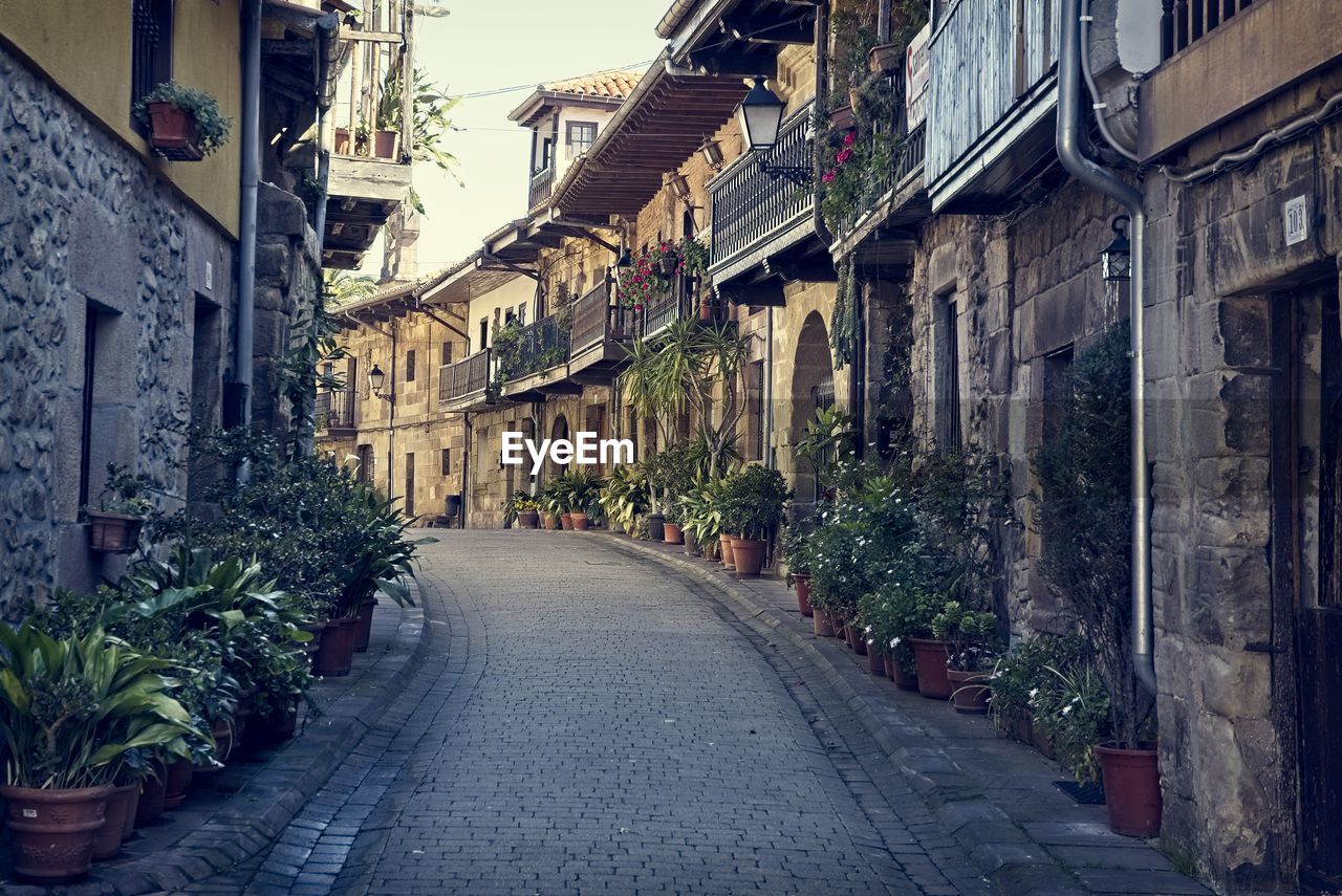 NARROW ALLEY ALONG BUILDINGS