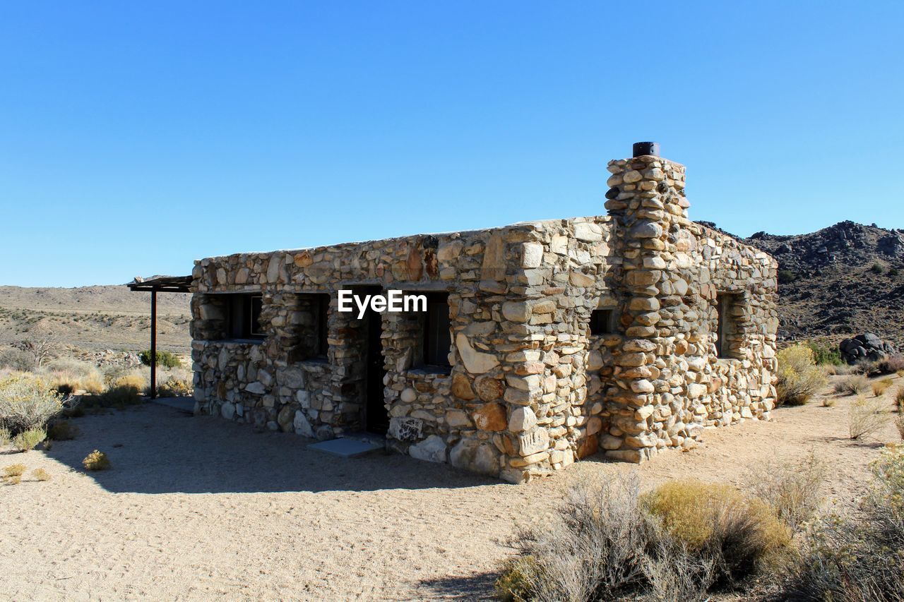 OLD RUINS AGAINST CLEAR SKY