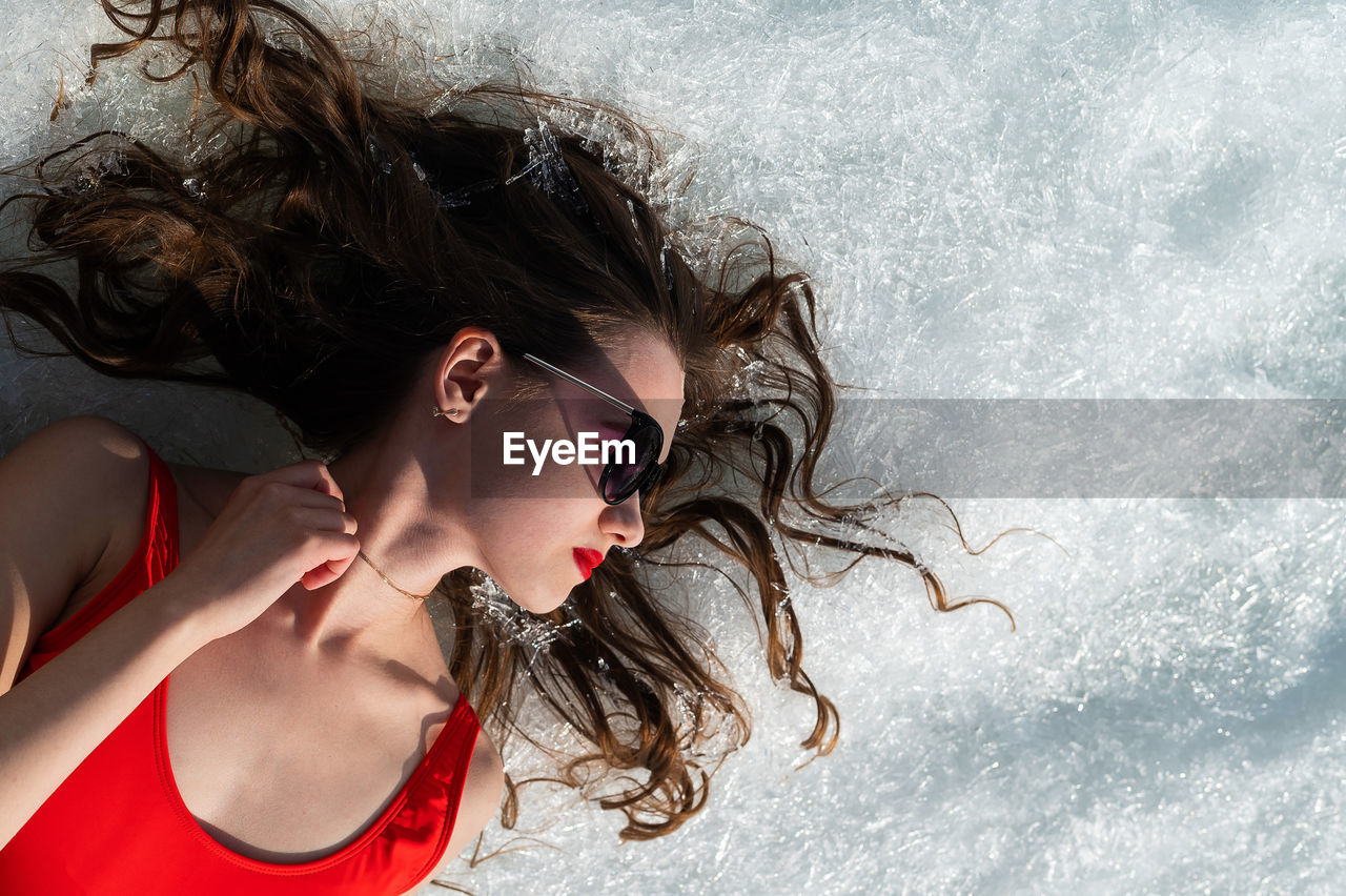 Close-up of young woman in snow