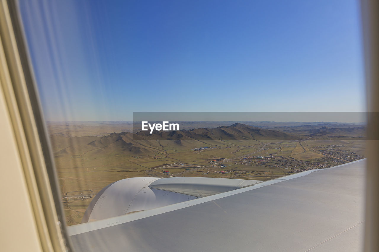 LANDSCAPE SEEN FROM AIRPLANE WINDOW