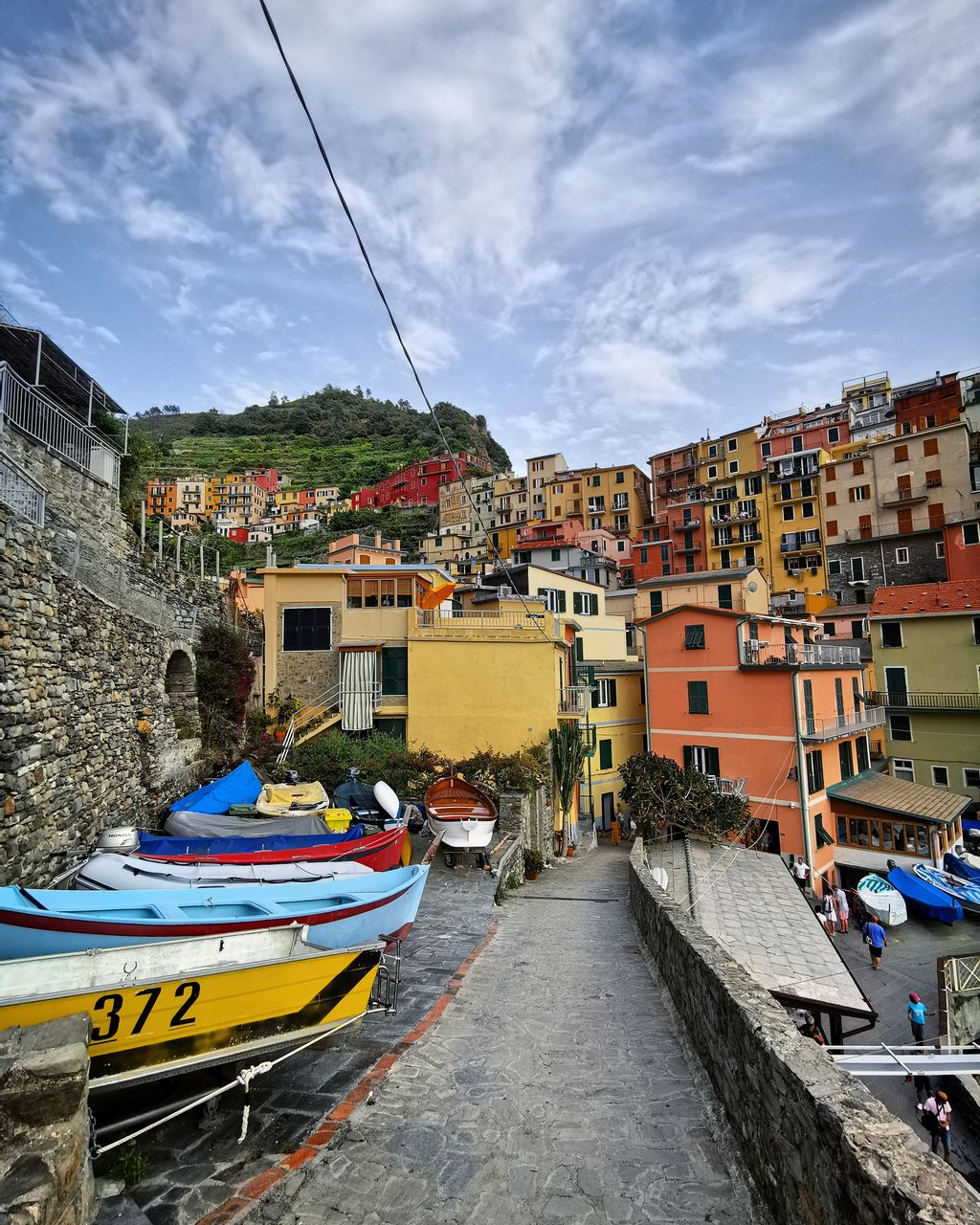 Canal amidst buildings in town against sky