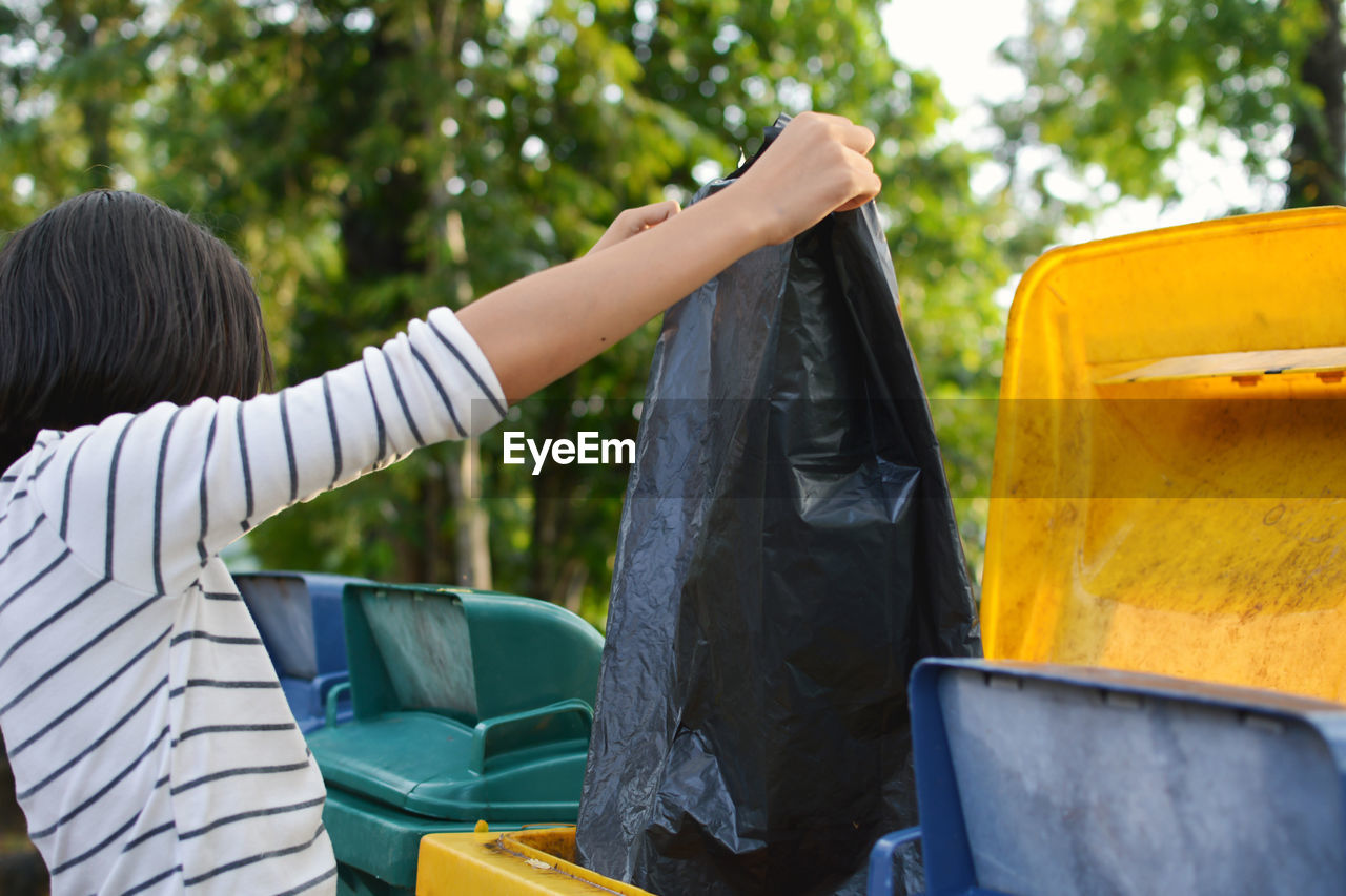 Woman taking out the trash