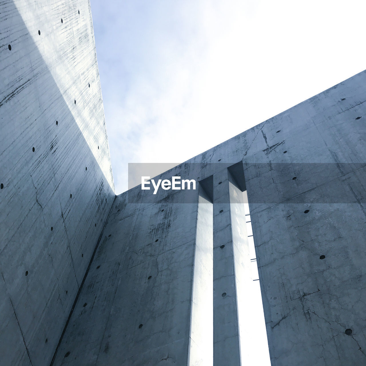 Low angle view of building against cloudy sky