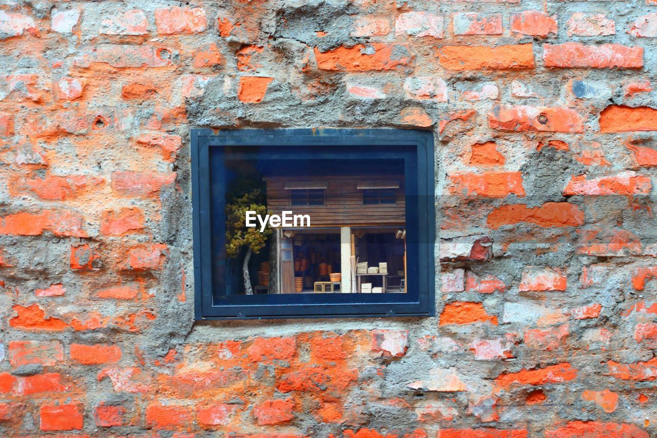 Window on brick wall of house