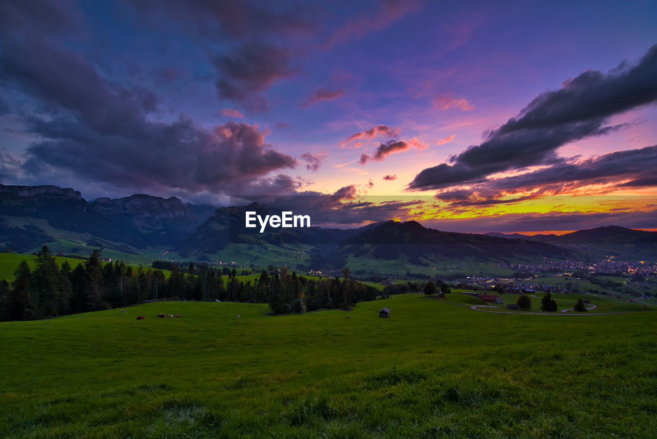 Scenic view of landscape against sky during sunset