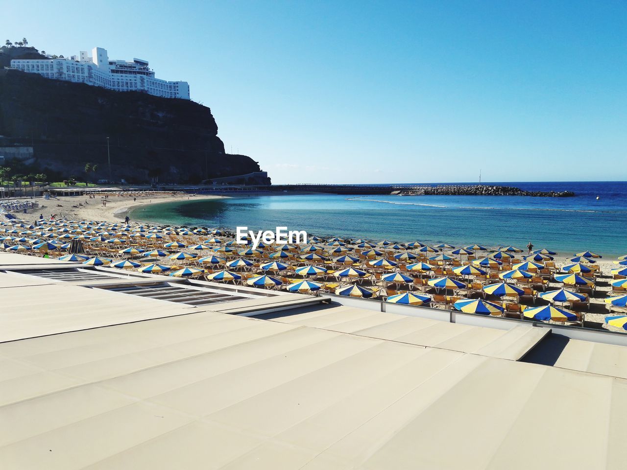 Scenic view of sea against clear blue sky