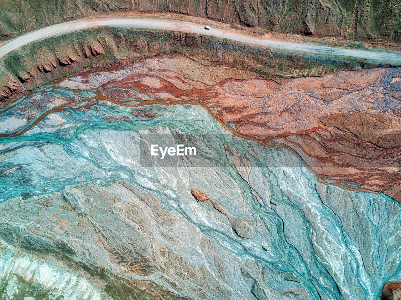 HIGH ANGLE VIEW OF ROCKS BY SWIMMING POOL