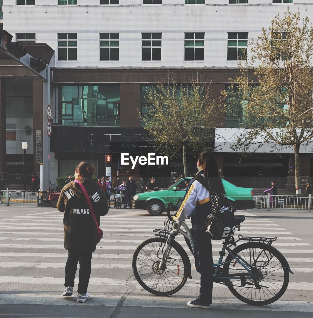 MAN WITH BICYCLE ON ROAD