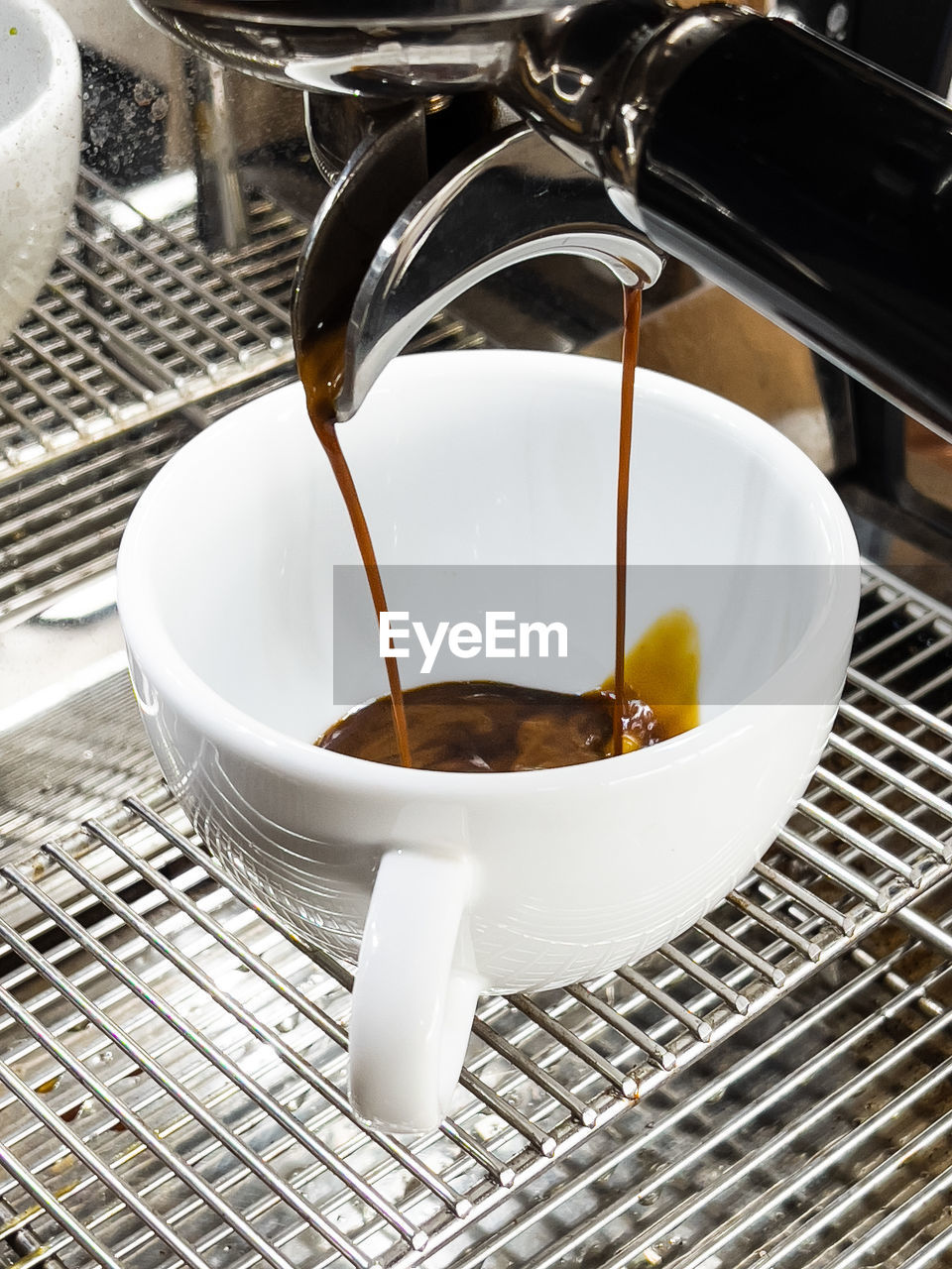 CLOSE-UP OF COFFEE BEANS IN WATER