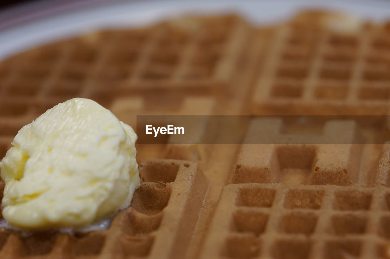 Close-up of butter melting on waffle