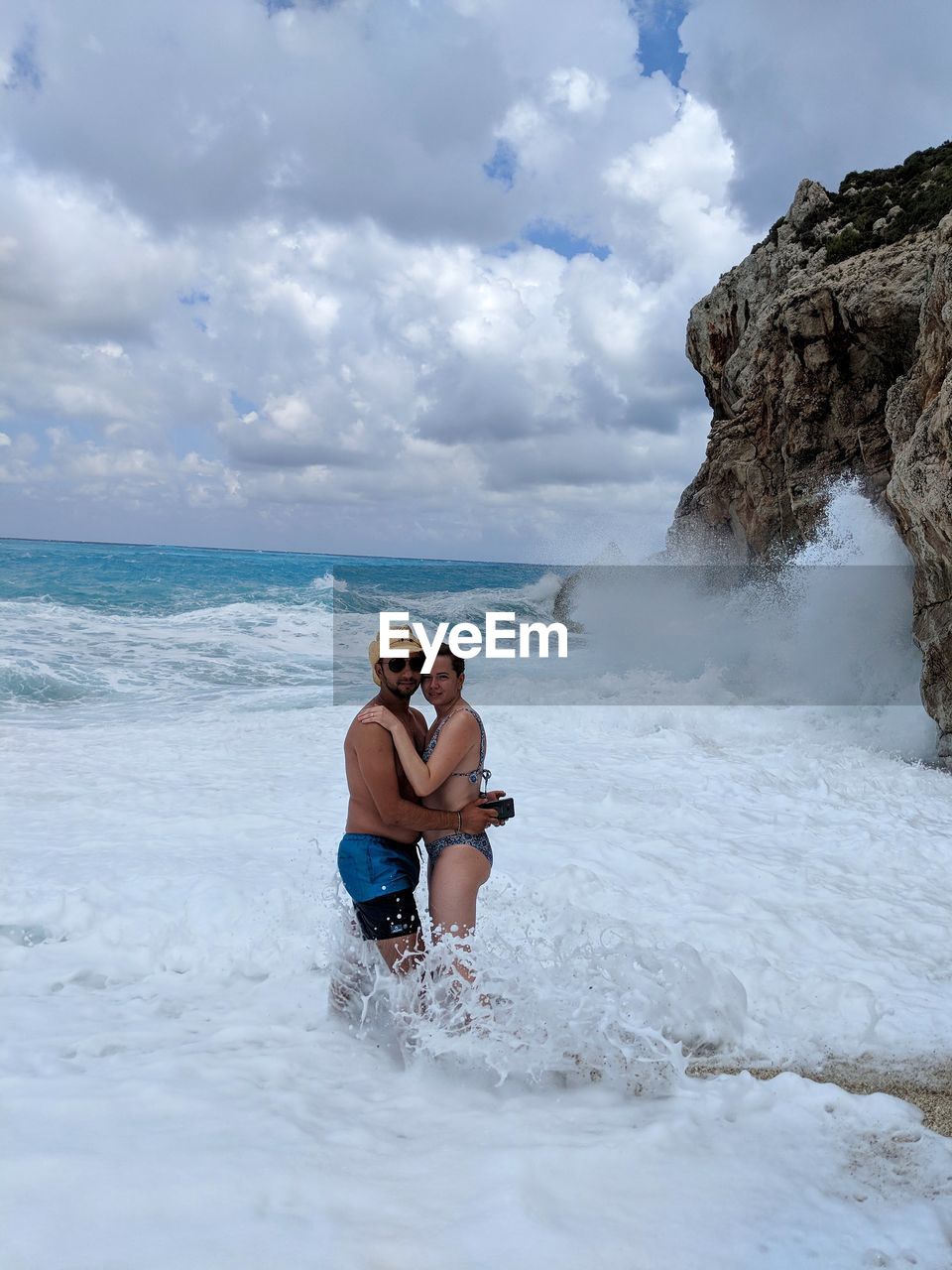 Couple standing at beach 