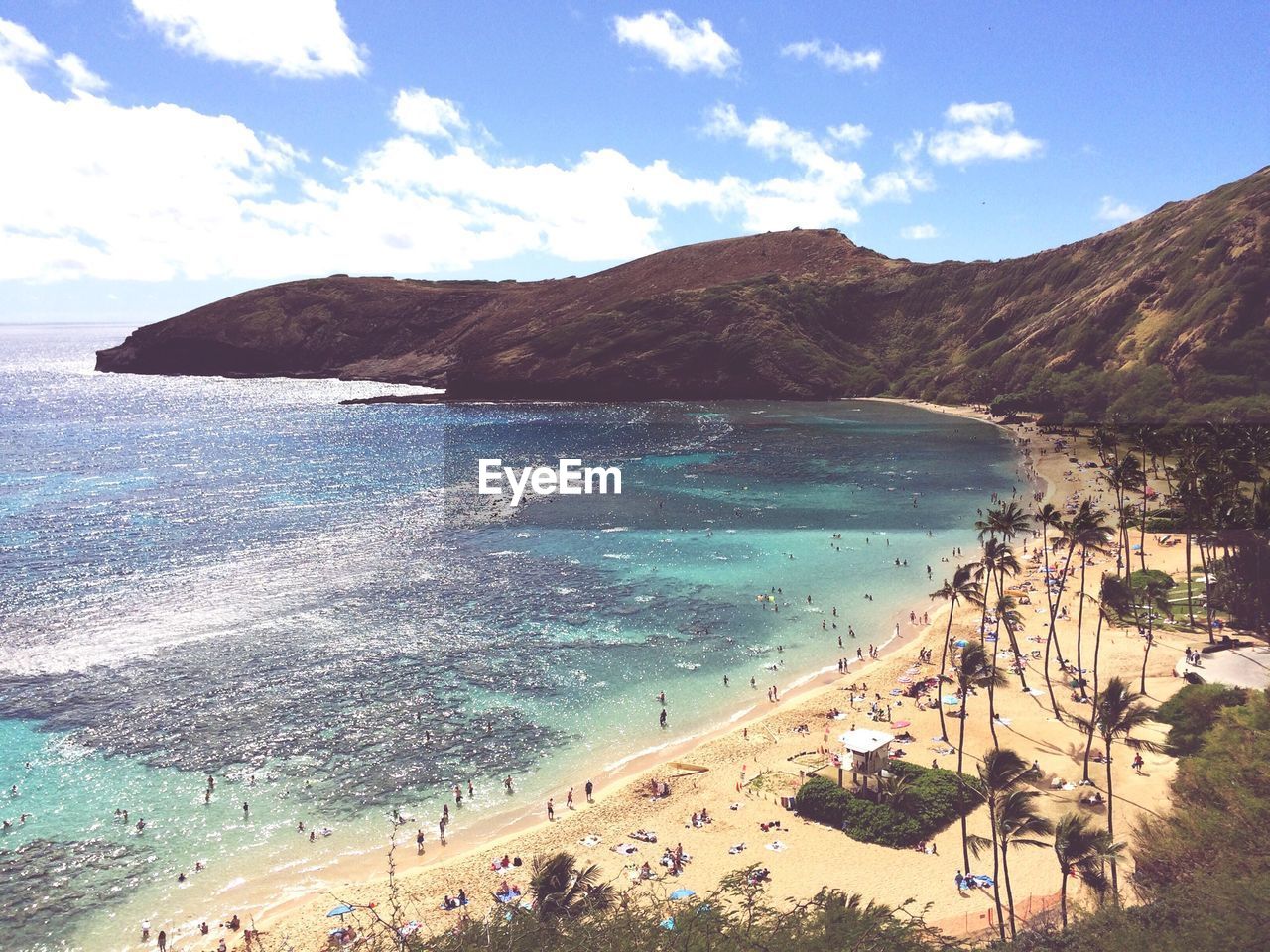 High angle view of people enjoying at waimanalo beach against sky