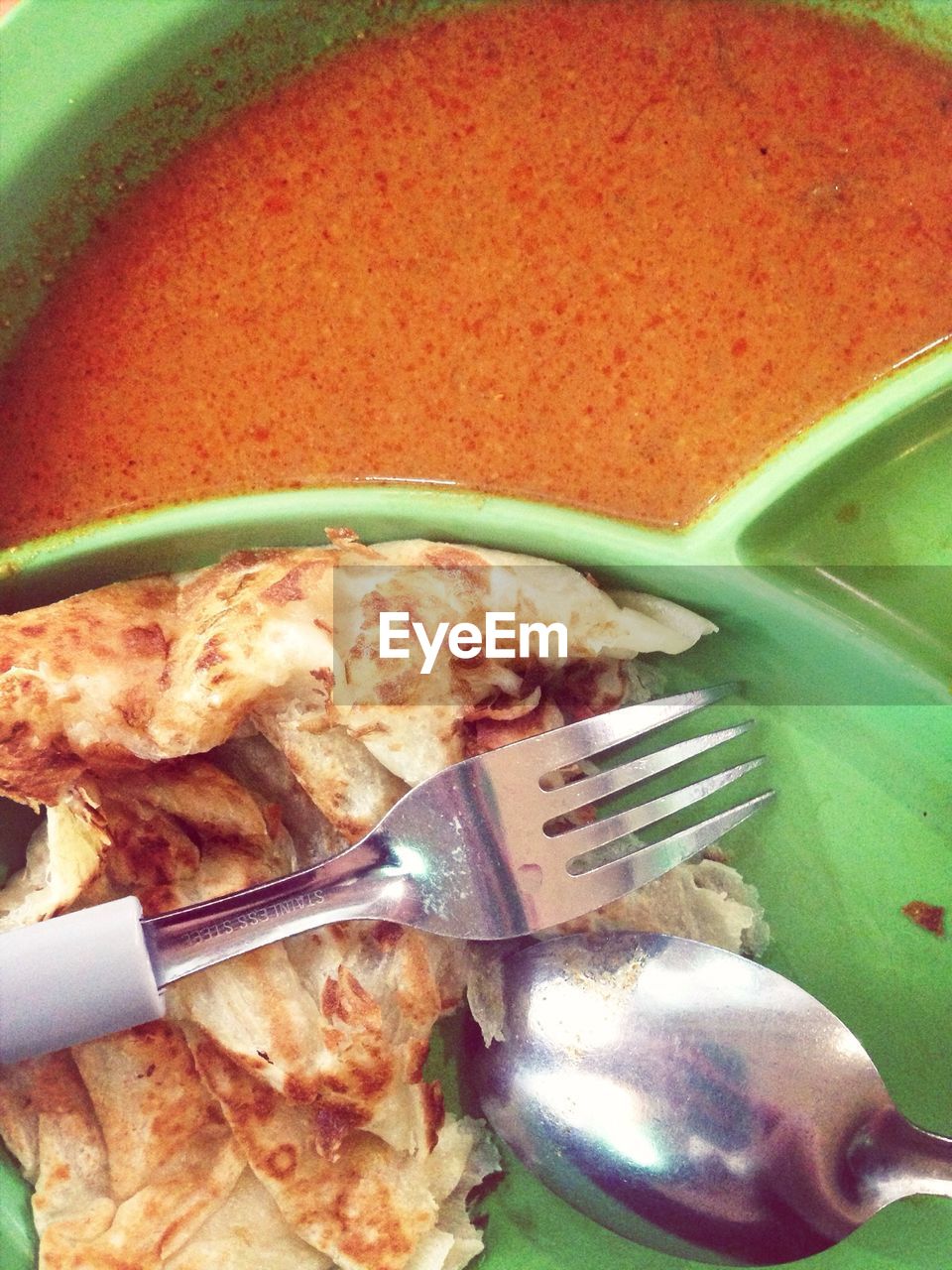 Close-up of prepared food with fork and spoon