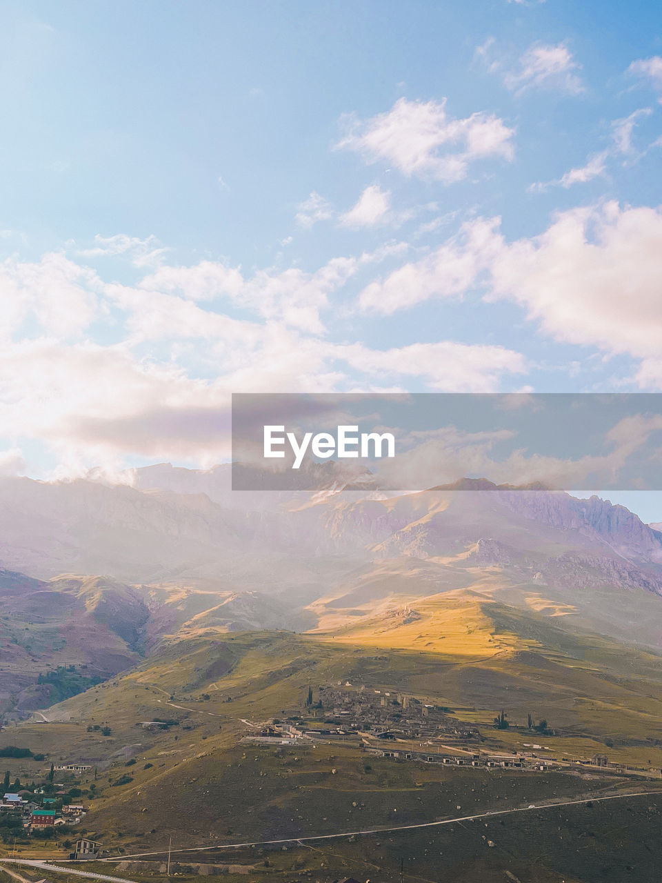 environment, landscape, scenics - nature, mountain, sky, cloud, beauty in nature, nature, land, mountain range, tranquility, travel, horizon, travel destinations, no people, plain, tranquil scene, valley, morning, outdoors, non-urban scene, rural scene, tourism, day, road, plateau, sunlight, blue, idyllic, rural area, social issues, fog, high angle view, plant, remote, architecture, lake