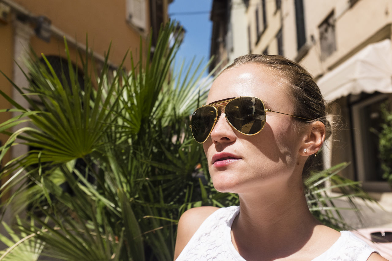 Close-up of young woman looking away