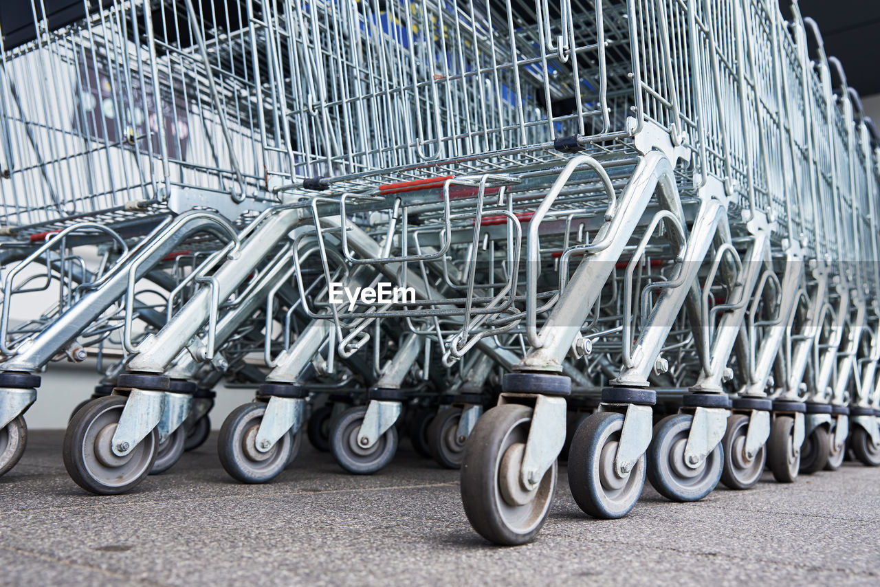 Many empty shopping carts on the shop parking