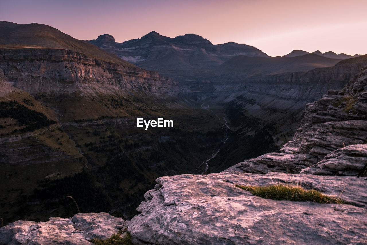Scenic view of mountains against sky during sunset