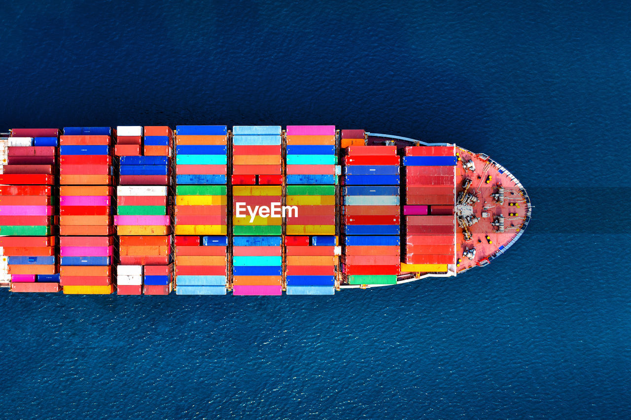 Aerial view of container ship in sea