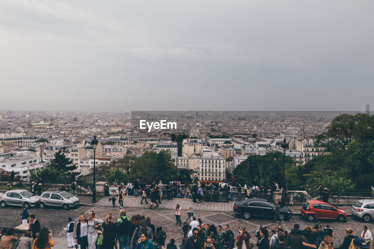 HIGH ANGLE VIEW OF CITY AGAINST SKY