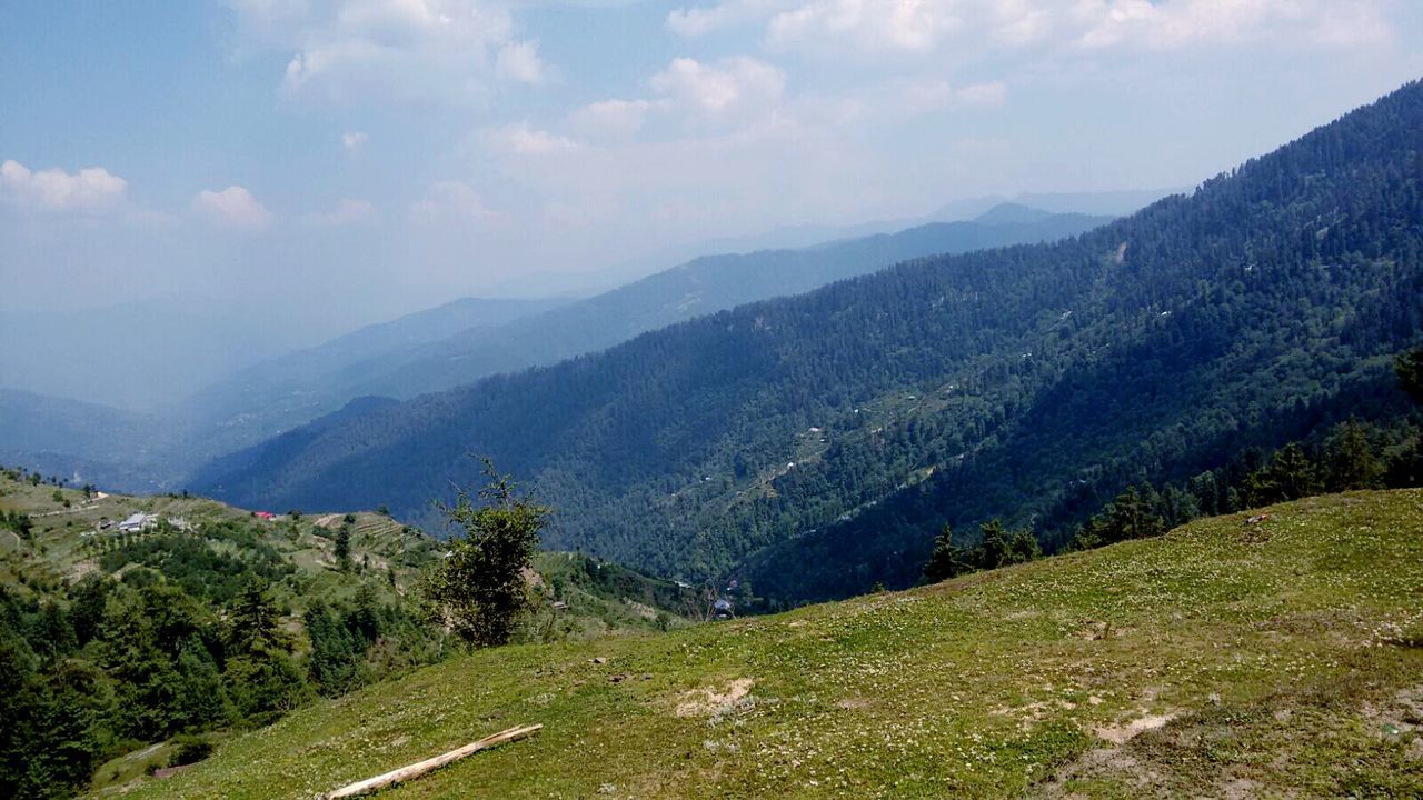 Scenic view of tree mountains against sky