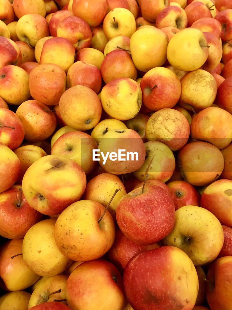 Full frame shot of apples for sale at market stall