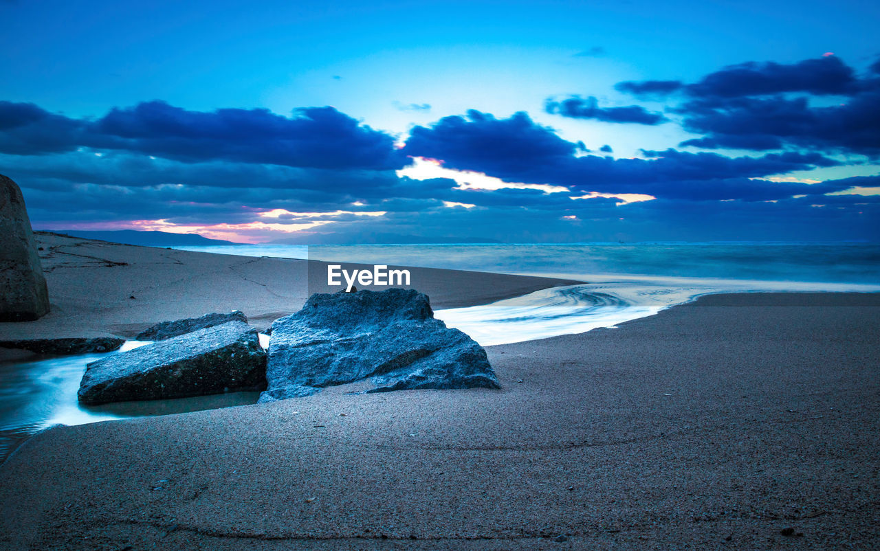 Scenic view of sea against blue sky