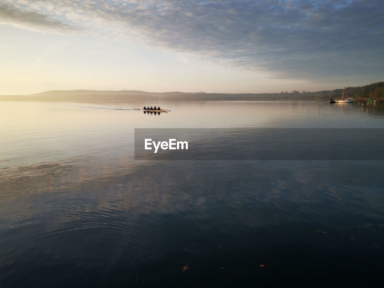 Scenic view of lake against sky during sunset