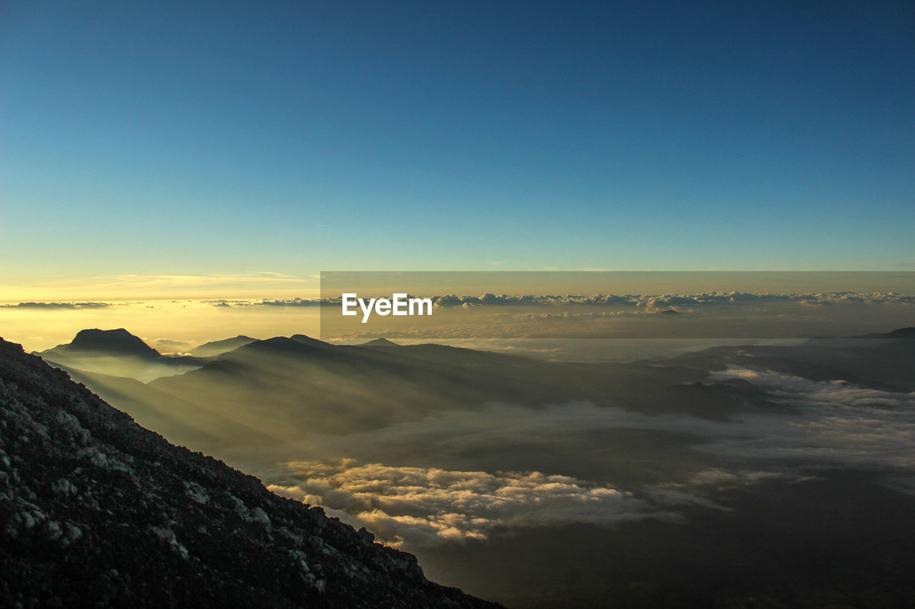 Scenic view of mountains against sky during sunset