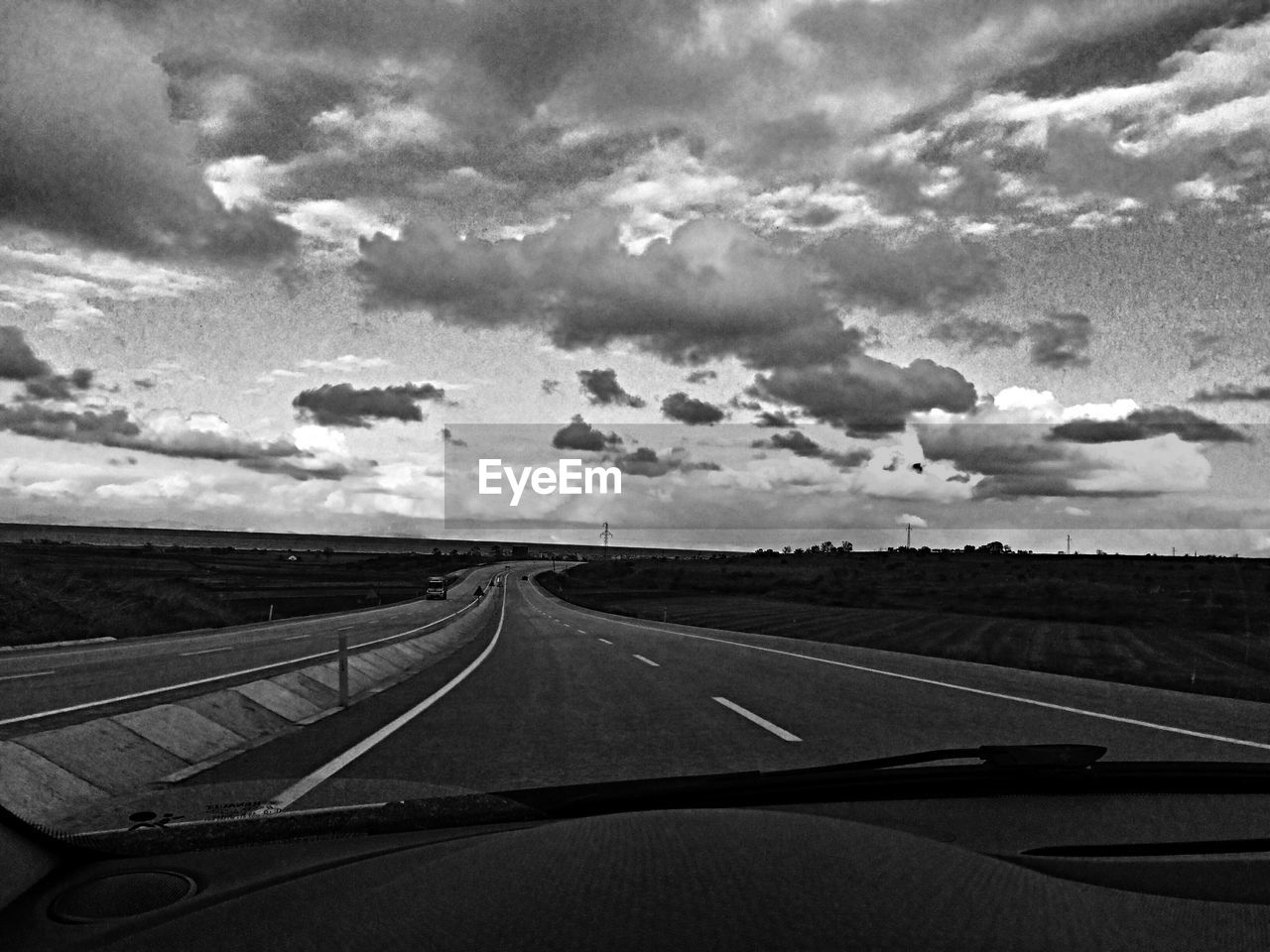 View of road seen through car windshield