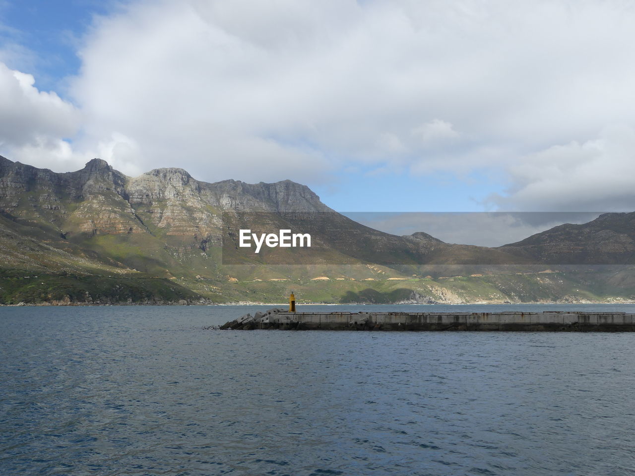 Hout bay harbour with chapmans peak , south africa