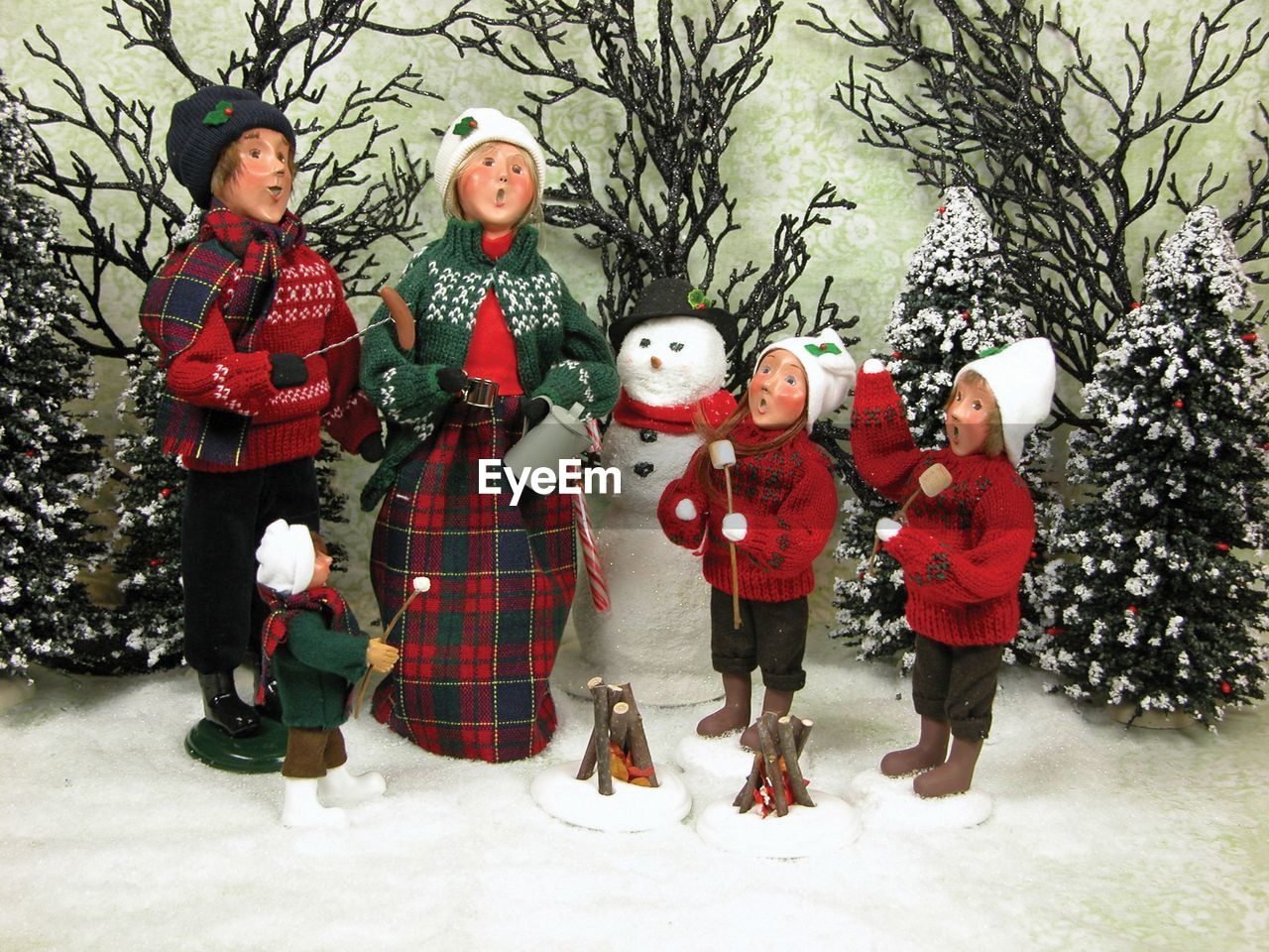 FULL LENGTH OF CHILDREN IN SNOW COVERED TREE
