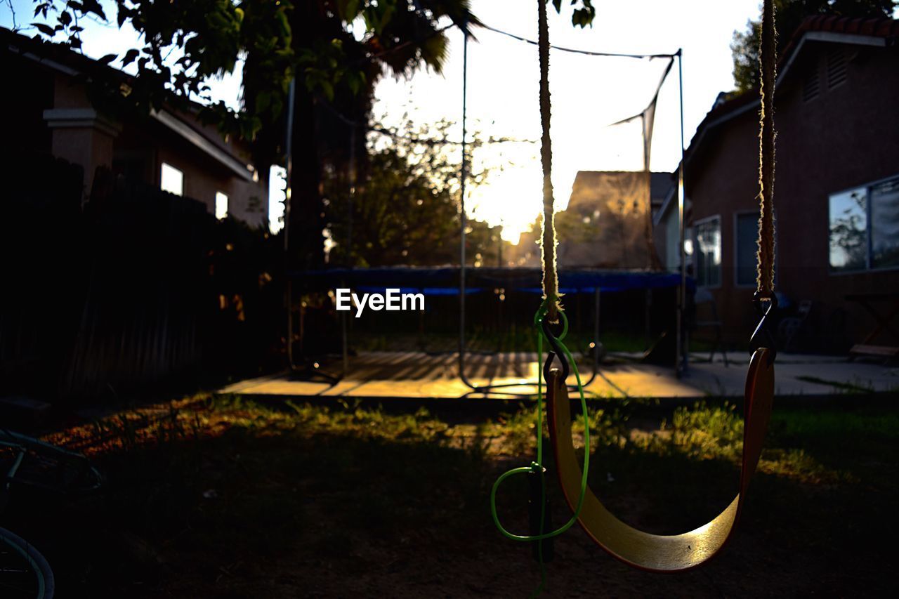 CLOSE-UP OF SWING AT PLAYGROUND