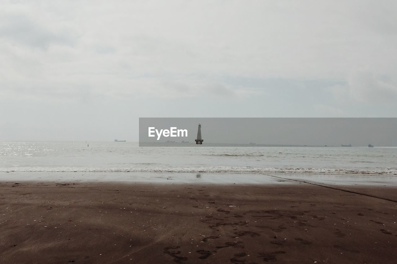 Scenic view of beach against sky