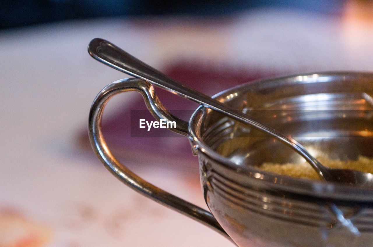 Close-up of spoon in jar on table