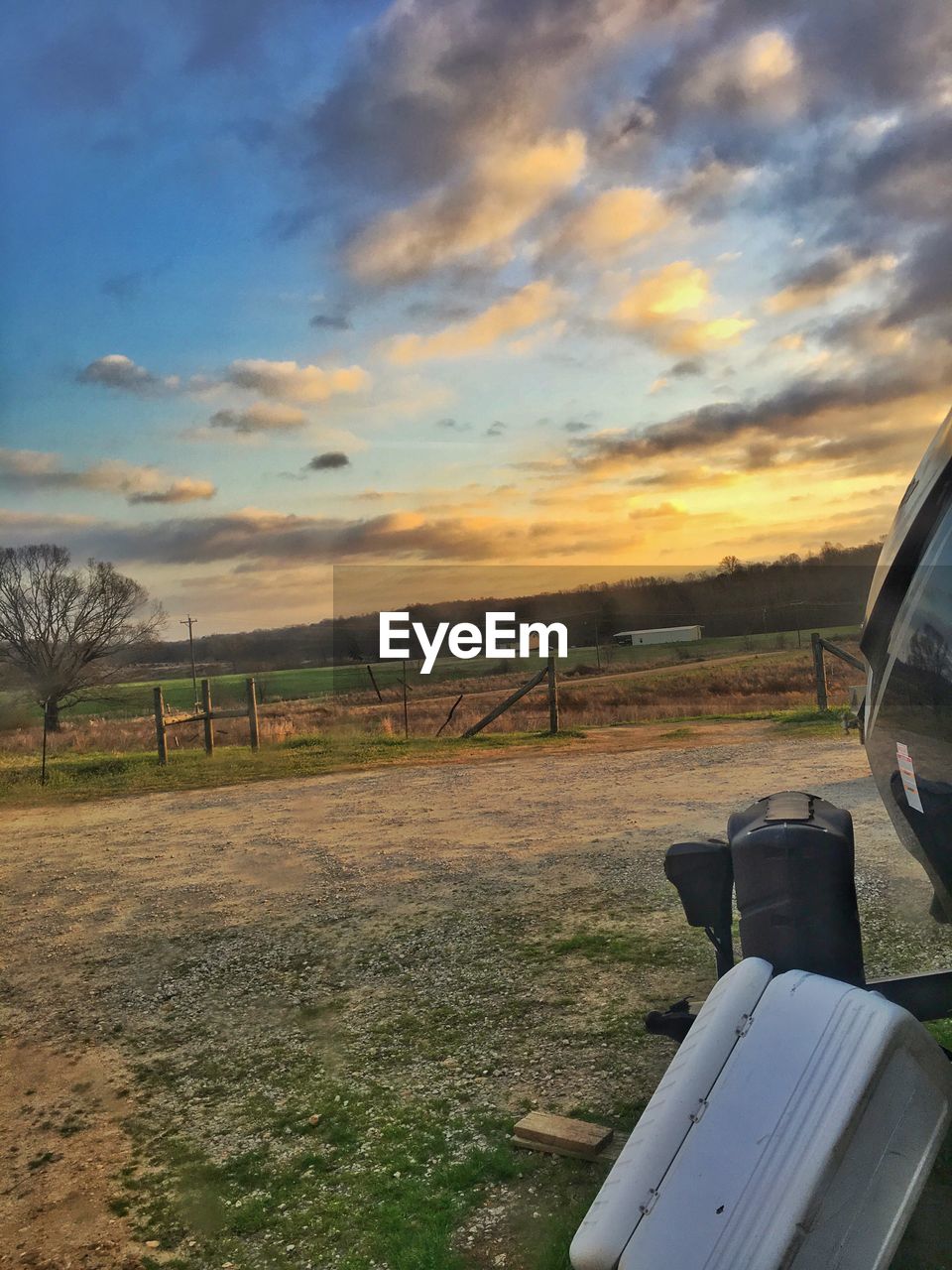 Scenic view of field against sky during sunset