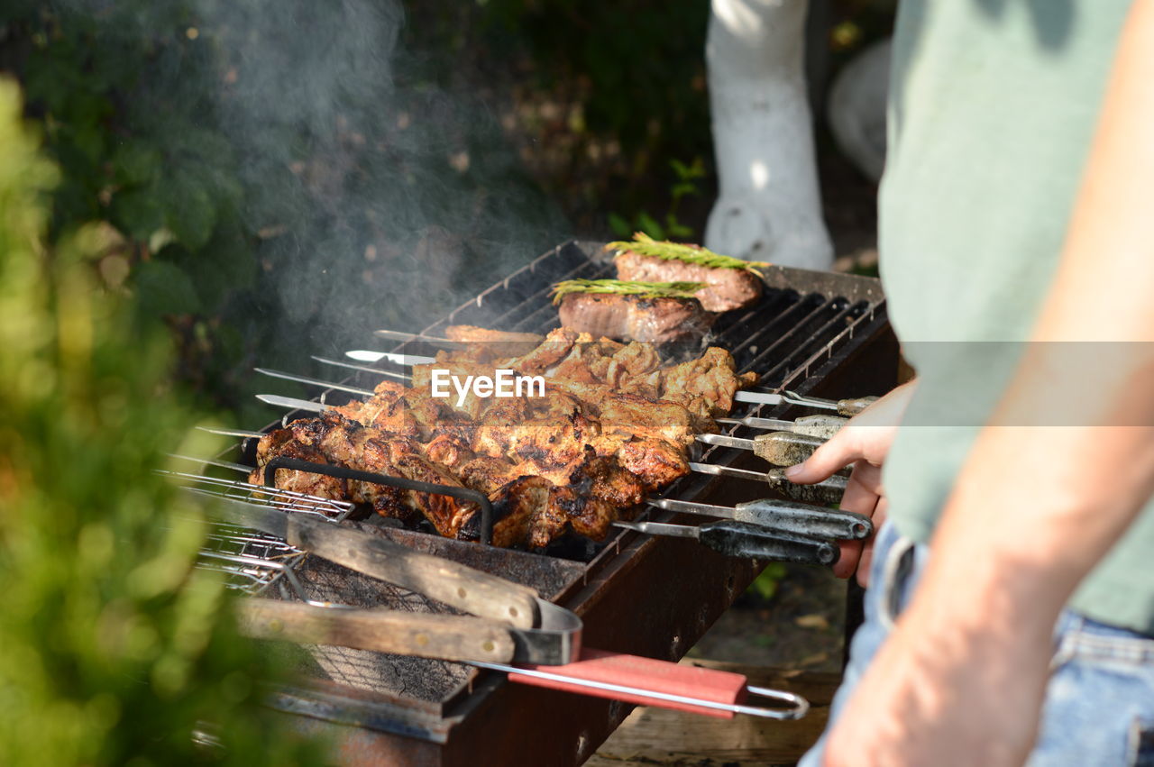 midsection of man preparing food